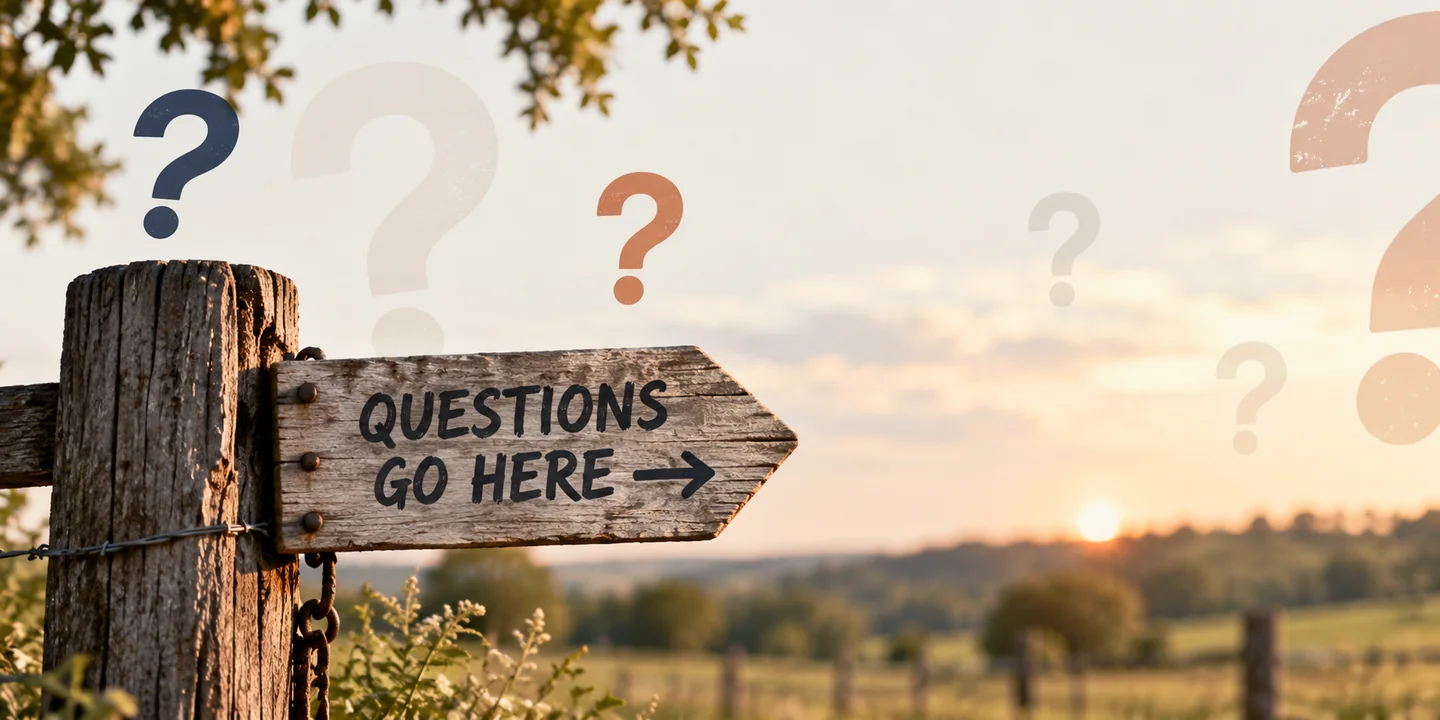 Rustic Questions Go Here sign at a Texas fence, surrounded by question marks